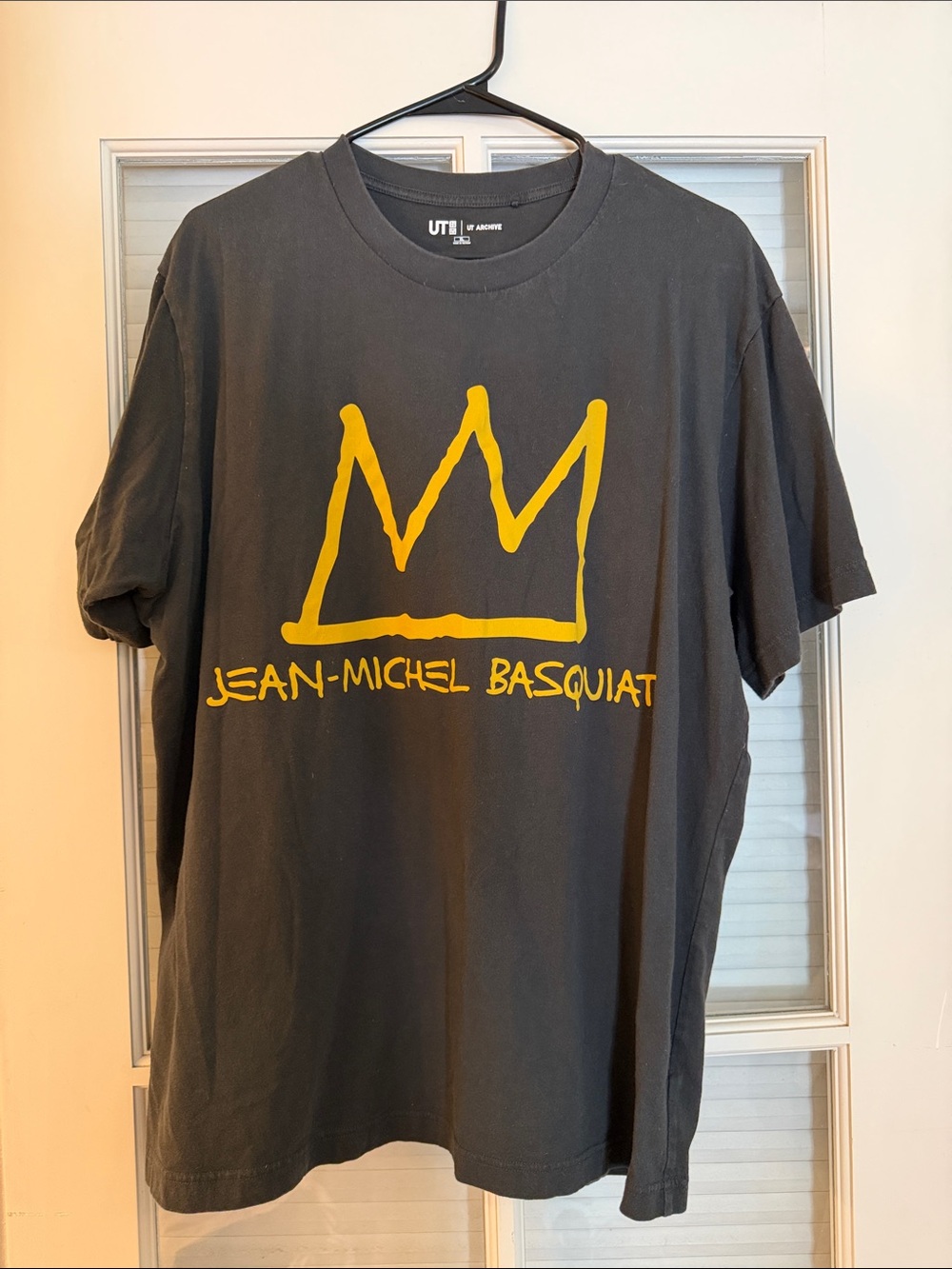 Uniqlo Black Tee with Yellow Crown Graphic